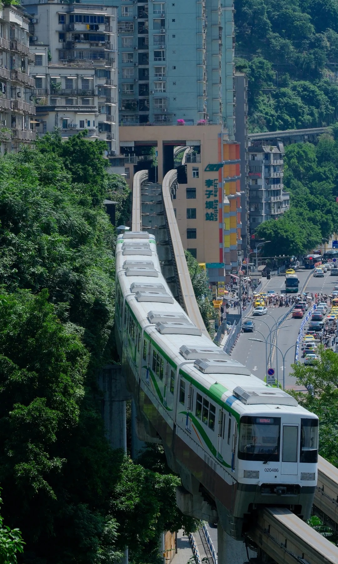 Chongqing CRT Line 2 Monorail train passing through a 19-story apartment building at Liziba Station